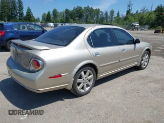 2002 Nissan Maxima GXE z VIN JN1DA31D92T207069, wystawiony jako IAAI lot #42439722 z przebiegiem 188 502 mil mil oraz . Historia ofert i sprzedaży dostępna na DreamBid. Obrazek 4.