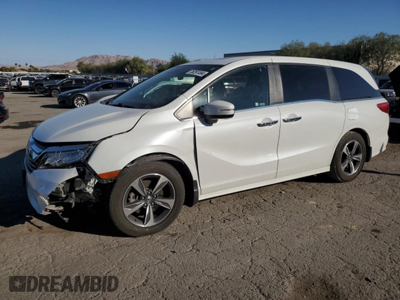 2020 Honda Odyssey Touring with VIN 5FNRL6H8XLB007622, listed as a Copart auction lot 76297494 with 83,452 mi miles and Salvage Title. Bid and sale history available at DreamBid. Image 1.