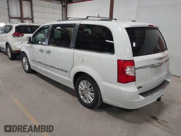2014 Chrysler Town & Country Limited with VIN 2C4RC1GG7ER178802, listed as a IAAI auction lot 41863918 with 103,777 mi miles and . Bid and sale history available at DreamBid. Image 3.