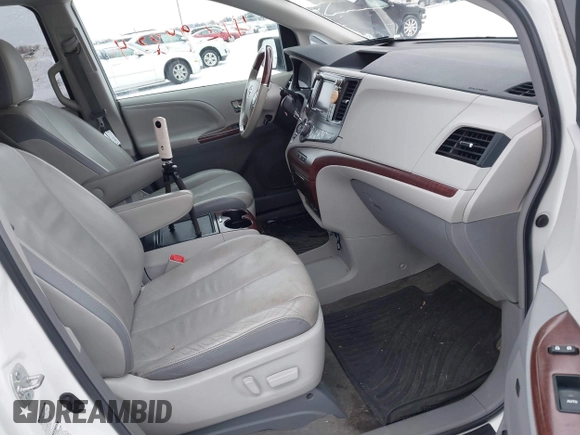 2013 Toyota Sienna XLE with VIN 5TDDK3DC2DS053559, listed as a IAAI auction lot 41299824 with 175,611 mi miles and . Bid and sale history available at DreamBid. Image 5.