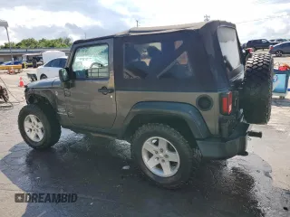 2017 Jeep Wrangler Willys Wheeler with VIN 1C4AJWAG2HL527192, listed as a Copart auction lot 58169245 with 88,737 mi miles and Salvage title. Bid and sale history available at DreamBid. Image 2.