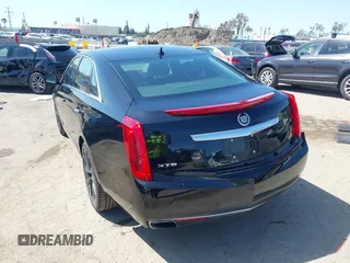 2013 Cadillac XTS Luxury z VIN 2G61P5S30D9220113, wystawiony jako IAAI lot #41970214 z przebiegiem 52 476 mil mil oraz . Historia ofert i sprzedaży dostępna na DreamBid. Obrazek 3.