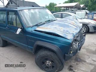 1996 Jeep Cherokee SE z VIN 1J4FJ28S8TL285634, wystawiony jako IAAI lot #42183816 z przebiegiem 260 237 mil mil oraz . Historia ofert i sprzedaży dostępna na DreamBid. Obrazek 18.