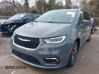 2021 Chrysler Pacifica Hybrid Touring L z VIN 2C4RC1L78MR596371, wystawiony jako IAAI lot #39993913 z przebiegiem 64 830 mil mil oraz . Historia ofert i sprzedaży dostępna na DreamBid. Obrazek 17.