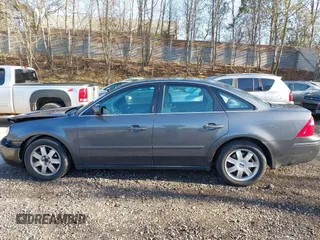 2005 Ford Five Hundred SE z VIN 1FAFP231X5G145153, wystawiony jako IAAI lot #42059747 z przebiegiem 59 114 mil mil oraz . Historia ofert i sprzedaży dostępna na DreamBid. Obrazek 14.
