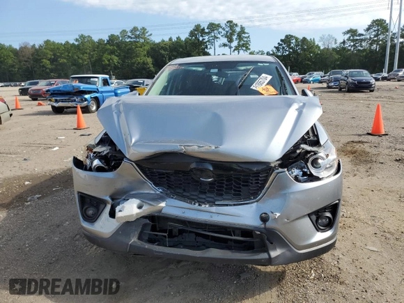 2015 Mazda CX-5 Touring with VIN JM3KE2CY7F0435914, listed as a Copart auction lot 61885704 with 0 mi miles and Salvage Title. Bid and sale history available at carsss.com. Image 5.