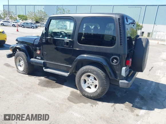 2001 Jeep Wrangler Sahara z VIN 1J4FA59S41P313113, wystawiony jako IAAI lot #42266173 z przebiegiem 125 792 mil mil oraz . Historia ofert i sprzedaży dostępna na DreamBid. Obrazek 3.
