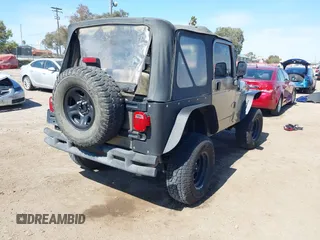 2005 Jeep Wrangler Sport with VIN 1J4FA49S65P342497, listed as a IAAI auction lot 41674606 with 123,457 mi miles. Bid and sale history available at carsss.com. Image 4.