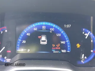 2022 Toyota Corolla Cross XLE z VIN 7MUEAABG1NV020142, wystawiony jako IAAI lot #41925148 z przebiegiem 36 047 mil mil oraz . Historia ofert i sprzedaży dostępna na DreamBid. Obrazek 7.