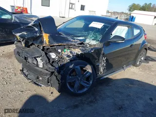 2014 Hyundai Veloster Turbo with VIN KMHTC6AE7EU207188, listed as a IAAI auction lot 41747279 with 111,807 mi miles. Bid and sale history available at carsss.com. Image 18.