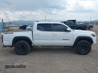 2022 Toyota Tacoma SR with VIN 3TMCZ5AN1NM478457, listed as a IAAI auction lot 42479107 with 59,547 mi miles and . Bid and sale history available at DreamBid. Image 14.