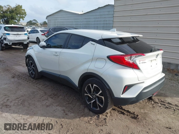 2018 Toyota C-HR XLE with VIN JTNKHMBX3J1010211, listed as a IAAI auction lot 40799443 with 104,148 mi miles. Bid and sale history available at carsss.com. Image 3.