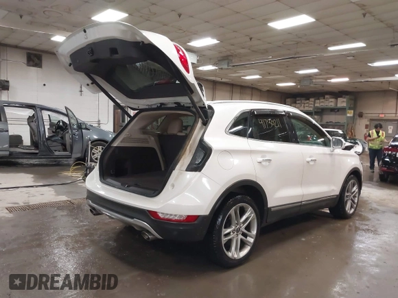 2019 Lincoln MKC Reserve with VIN 5LMCJ3D9XKUL17812, listed as a IAAI auction lot 41730211 with 56,716 mi miles and . Bid and sale history available at DreamBid. Image 4.