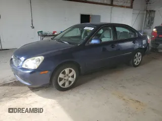 2007 Kia Optima LX z VIN KNAGE123275134760, wystawiony jako Copart lot #58385145 z przebiegiem 157 588 mil mil oraz Szkoda całkowita • Salvage title. Historia ofert i sprzedaży dostępna na DreamBid. Obrazek 1.