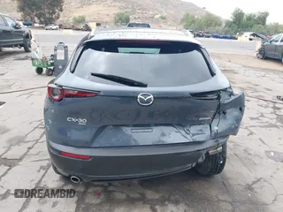 2022 Mazda CX-30 S Carbon Edition with VIN 3MVDMBCL0NM456154, listed as a IAAI auction lot 42153202 with 40,372 mi miles and . Bid and sale history available at DreamBid. Image 16.