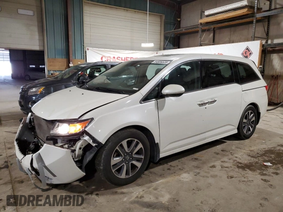 2014 Honda Odyssey Touring with VIN 5FNRL5H90EB137575, listed as a Copart auction lot 54606535 with 168,714 mi miles and Salvage title. Bid and sale history available at DreamBid. Image 1.