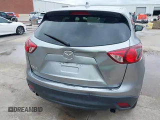 2014 Mazda CX-5 Touring z VIN JM3KE2CY8E0369145, wystawiony jako IAAI lot #42462985 z przebiegiem 155 480 mil mil oraz . Historia ofert i sprzedaży dostępna na DreamBid. Obrazek 18.