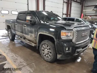 2017 GMC Sierra 2500HD Denali with VIN 1GT12UEY1HF212175, listed as a IAAI auction lot 40998857 with 80,297 mi miles. Bid and sale history available at carsss.com. Image 1.