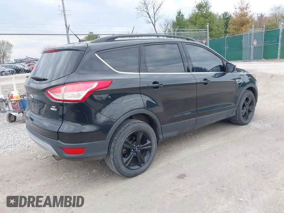 2015 Ford Escape SE with VIN 1FMCU9GX8FUC41438, listed as a IAAI auction lot 41869587 with 109,728 mi miles. Bid and sale history available at carsss.com. Image 4.
