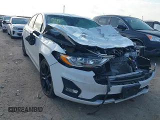 2020 Ford Fusion SE z VIN 3FA6P0HD5LR148104, wystawiony jako IAAI lot #42049789 z przebiegiem 88 885 mil mil oraz . Historia ofert i sprzedaży dostępna na DreamBid. Obrazek 1.