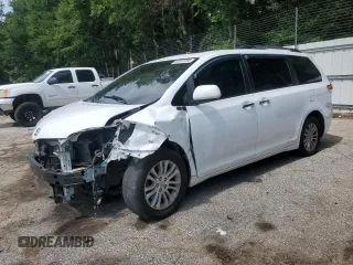 2014 Toyota Sienna XLE with VIN 5TDYK3DC5ES406279, listed as a Copart auction lot 62359795 with 248,782 mi miles and Salvage title. Bid and sale history available at DreamBid. Image 1.