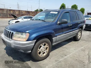 2002 Jeep Grand Cherokee z VIN 1J4GX38N42C195706, wystawiony jako Copart lot #64054105 z przebiegiem 124 811 mil mil oraz Szkoda całkowita • Salvage title. Historia ofert i sprzedaży dostępna na DreamBid. Obrazek 1.