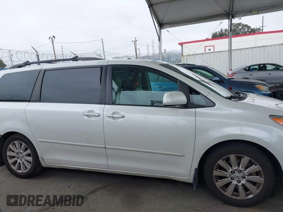 2011 Toyota Sienna XLE AAS with VIN 5TDYK3DC8BS148948, listed as a IAAI auction lot 41806293 with 144,645 mi miles and . Bid and sale history available at DreamBid. Image 14.