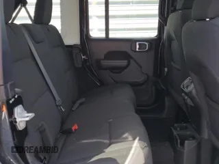 2023 Jeep Wrangler Sport with VIN 1C4HJXDNXPW701795, listed as a Copart auction lot 50451444 with 7,274 mi miles and Salvage Title. Bid and sale history available at DreamBid. Image 10.