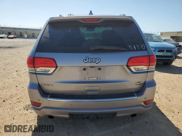 2014 Jeep Grand Cherokee Overland with VIN 1C4RJFCG7EC153156, listed as a Copart auction lot 52452925 with 152,348 mi miles and Salvage Title. Bid and sale history available at DreamBid. Image 6.