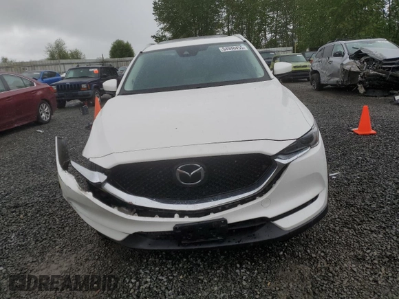 2019 Mazda CX-5 Grand Touring with VIN JM3KFBDM4K0669589, listed as a Copart auction lot 54948455 with 64,475 mi miles and Salvage Title. Bid and sale history available at carsss.com. Image 5.