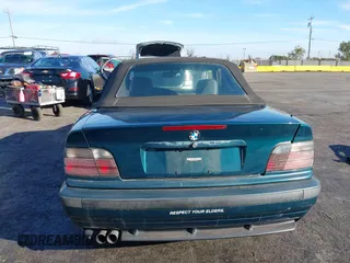 1997 BMW 3-Series 328IC with VIN WBABK8323VET99072, listed as a IAAI auction lot 40669447 with 135,584 mi miles. Bid and sale history available at carsss.com. Image 17.