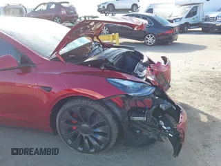 2024 Tesla Model Y Performance with VIN 7SAYGDEF3RF032980, listed as a IAAI auction lot 41619450 with 12,105 mi miles and . Bid and sale history available at DreamBid. Image 19.