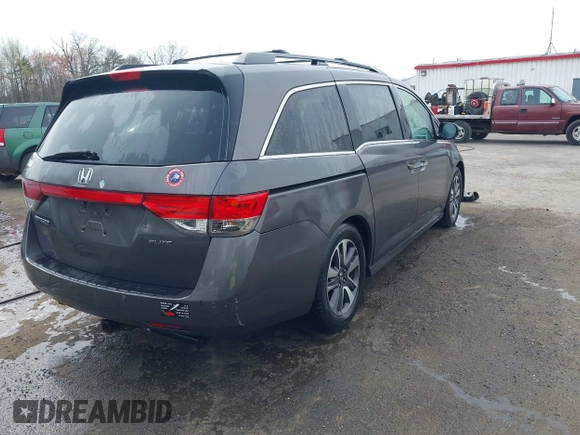 2014 Honda Odyssey Touring with VIN 5FNRL5H94EB020257, listed as a IAAI auction lot 41924245 with 204,526 mi miles and . Bid and sale history available at DreamBid. Image 4.