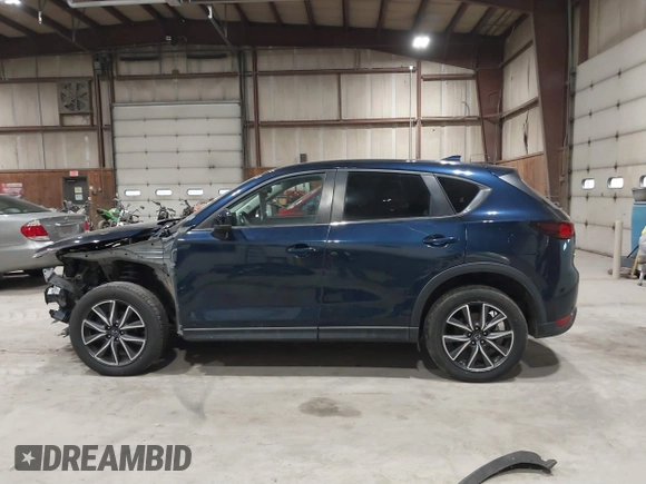 2018 Mazda CX-5 Touring with VIN JM3KFBCM5J0434716, listed as a IAAI auction lot 41738956 with 108,264 mi miles and . Bid and sale history available at DreamBid. Image 15.