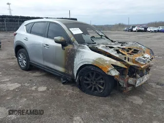2023 Mazda CX-5 S Carbon Edition z VIN JM3KFBCMXP0265141, wystawiony jako IAAI lot #41946750 z przebiegiem Nie podano mil oraz . Historia ofert i sprzedaży dostępna na DreamBid. Obrazek 1.