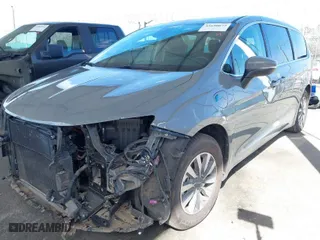 2023 Chrysler Pacifica Hybrid Touring L with VIN 2C4RC1L73PR509853, listed as a IAAI auction lot 41690872 with 83,014 mi miles. Bid and sale history available at carsss.com. Image 2.