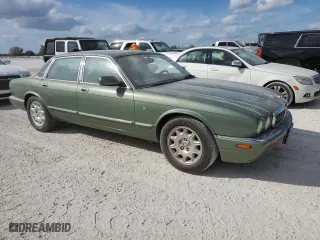 1999 Jaguar XJ with VIN SAJHD1043XC869413, listed as a Copart auction lot 76940624 with 0 mi miles and Salvage Title. Bid and sale history available at carsss.com. Image 4.