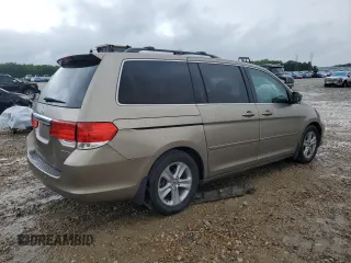 2010 Honda Odyssey Touring z VIN 5FNRL3H97AB082525, wystawiony jako Copart lot #56410845 z przebiegiem 94 819 mil mil oraz Szkoda całkowita • Salvage title. Historia ofert i sprzedaży dostępna na DreamBid. Obrazek 3.