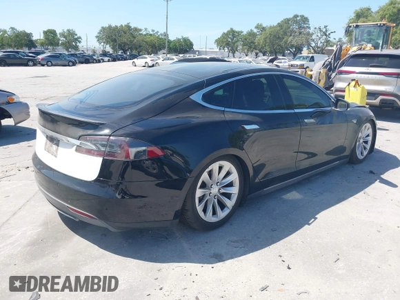 2014 Tesla Model S P85D with VIN 5YJSA1H25EFP65571, listed as a IAAI auction lot 42185442 with 115,990 mi miles and . Bid and sale history available at DreamBid. Image 4.