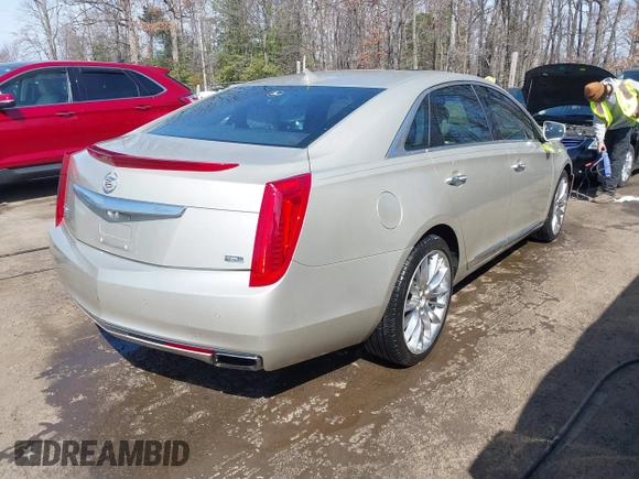 2013 Cadillac XTS Platinum z VIN 2G61U5S37D9209926, wystawiony jako IAAI lot #41754716 z przebiegiem 126 239 mil mil oraz . Historia ofert i sprzedaży dostępna na DreamBid. Obrazek 4.