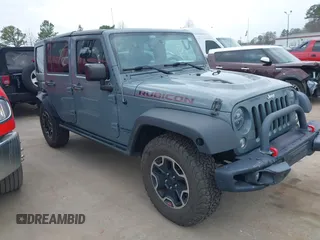 2015 Jeep Wrangler Unlimited Rubicon Hard Rock with VIN 1C4HJWFG1FL679873, listed as a IAAI auction lot 41508722 with 97,165 mi miles and . Bid and sale history available at DreamBid. Image 1.