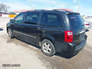 2010 Dodge Grand Caravan SXT with VIN 2D4RN5D18AR233143, listed as a IAAI auction lot 41880502 with 145,356 mi miles. Bid and sale history available at carsss.com. Image 3.