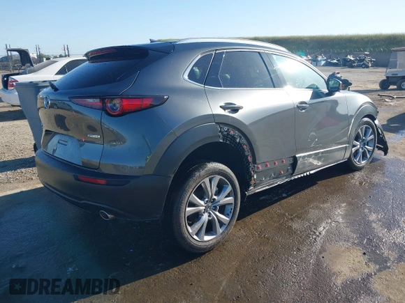 2022 Mazda CX-30 S Premium with VIN 3MVDMBDL0NM413867, listed as a IAAI auction lot 42082560 with 12,375 mi miles and . Bid and sale history available at DreamBid. Image 4.