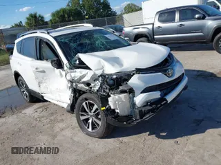 2018 Toyota RAV4 XLE with VIN JTMWFREV8JJ157496, listed as a IAAI auction lot 41816017 with 64,767 mi miles. Bid and sale history available at carsss.com. Image 1.