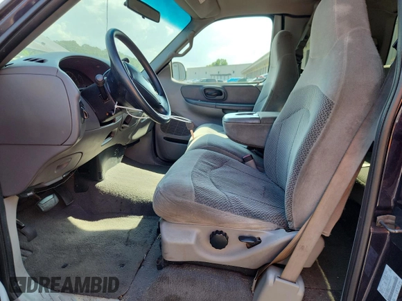 1999 Ford F-150 with VIN 1FTZX1729XNB58298, listed as a Copart auction lot 62369755 with 165,150 mi miles and Clean title. Bid and sale history available at DreamBid. Image 7.