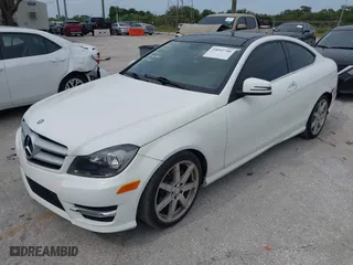 2013 Mercedes-Benz C-Class C 250 with VIN WDDGJ4HB7DG050891, listed as a IAAI auction lot 39092790 with 105,411 mi miles. Bid and sale history available at carsss.com. Image 2.
