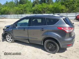 2015 Ford Escape Titanium with VIN 1FMCU9J92FUC74879, listed as a Copart auction lot 54683185 with 143,436 mi miles and Salvage title. Bid and sale history available at DreamBid. Image 2.