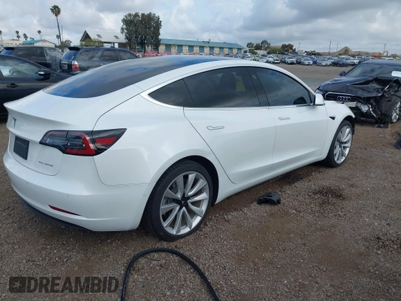 2019 Tesla Model 3 Long Range with VIN 5YJ3E1EBXKF512710, listed as a IAAI auction lot 42063737 with 90,721 mi miles and . Bid and sale history available at DreamBid. Image 4.