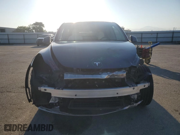 2023 Tesla Model Y Long Range with VIN 7SAYGDEE7PA146322, listed as a Copart auction lot 54071165 with 38,334 mi miles and Salvage Title. Bid and sale history available at DreamBid. Image 5.