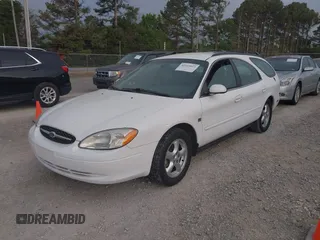2003 Ford Taurus SE z VIN 1FAFP58S63A158422, wystawiony jako IAAI lot #41933813 z przebiegiem 71 990 mil mil oraz . Historia ofert i sprzedaży dostępna na DreamBid. Obrazek 2.